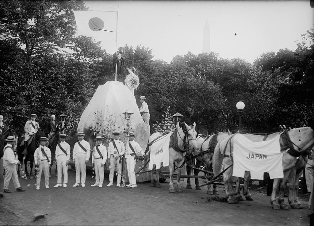A parade float representing Japan, with the Washington Monument in the background. Photograph via Harris & Ewing Collection (Library of Congress). 