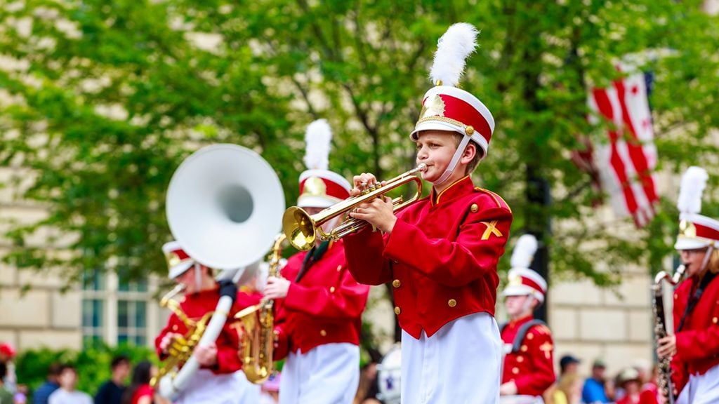 fourth-of-july-parades-dc_featured - Washingtonian Concordia Lutheran School Marching Cougars in the annual National Independence Day Parade 2015. Photograph by Png-Studio/iStock.