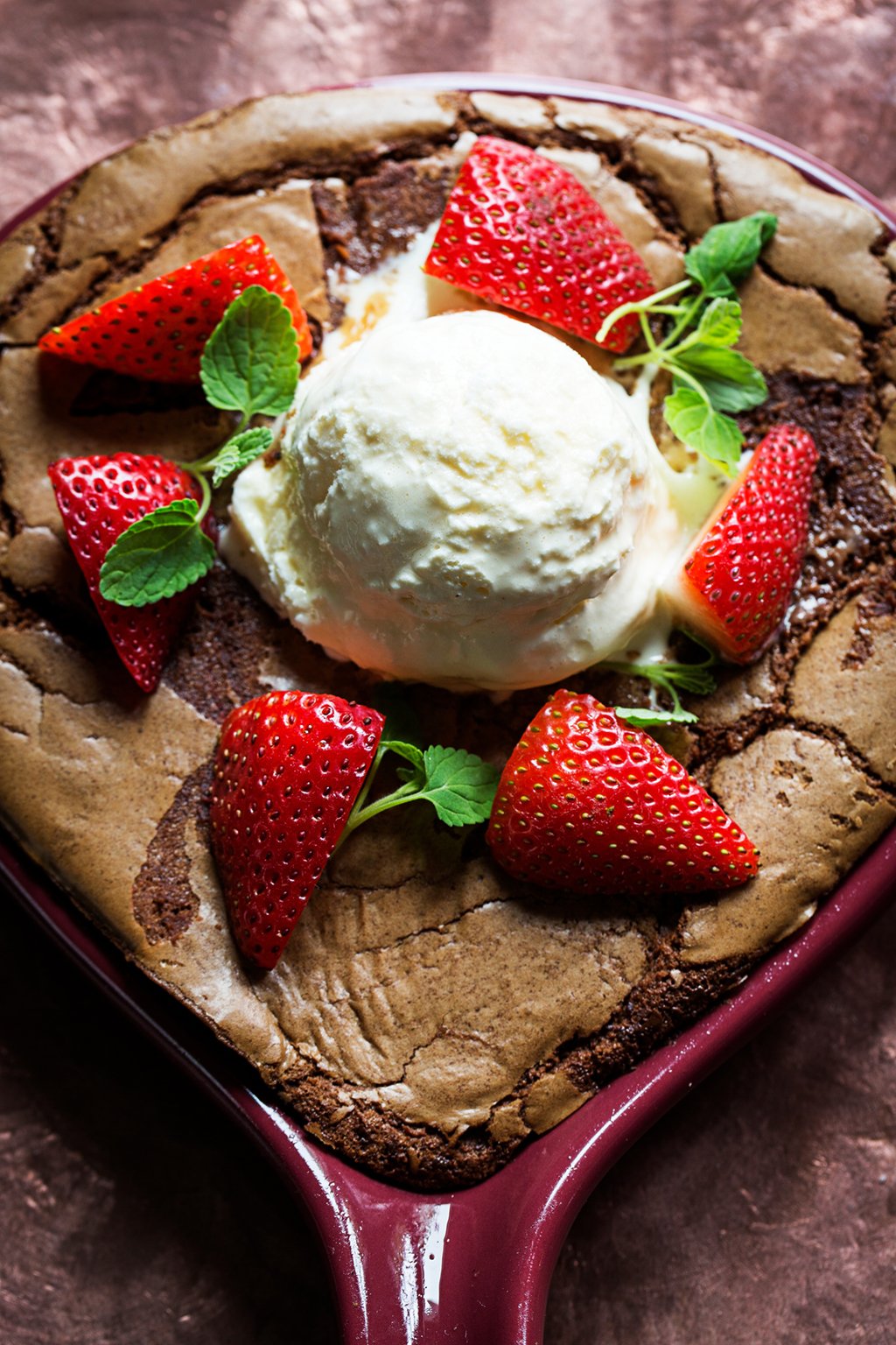 Helen's skillet brownie with vanilla ice cream and strawberries. Photograph by Scott Suchman.