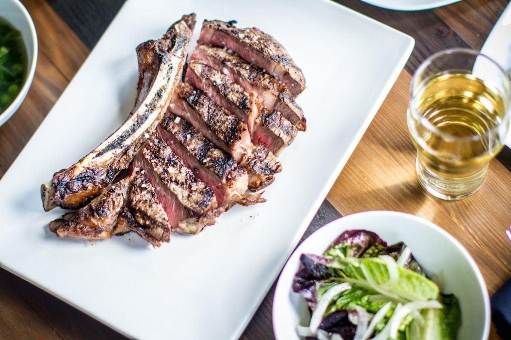 Bone-In Ribeye-2 - Washingtonian A traditional "cider house" menu includes salt cod fritters, rockfish escabeche, and a bone-in ribeye for two. Photograph by Farrah Skeiky