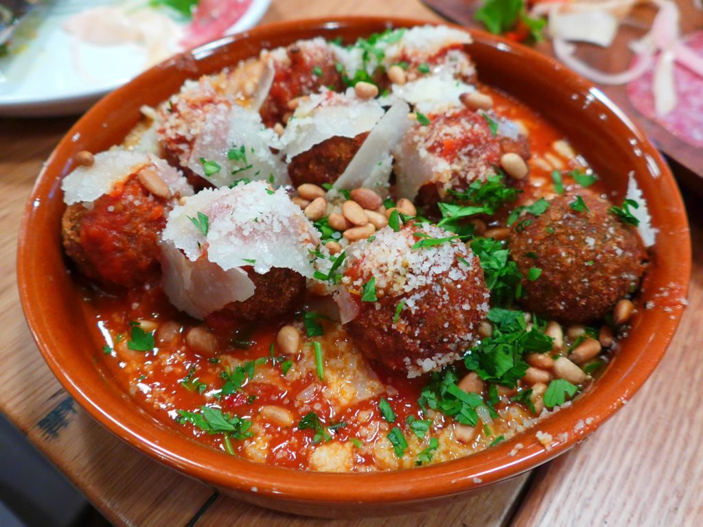 You won't miss the meat in these bread-based meatballs, cloaked in spicy tomato sauce and cheese. Photograph by Anna Spiegel