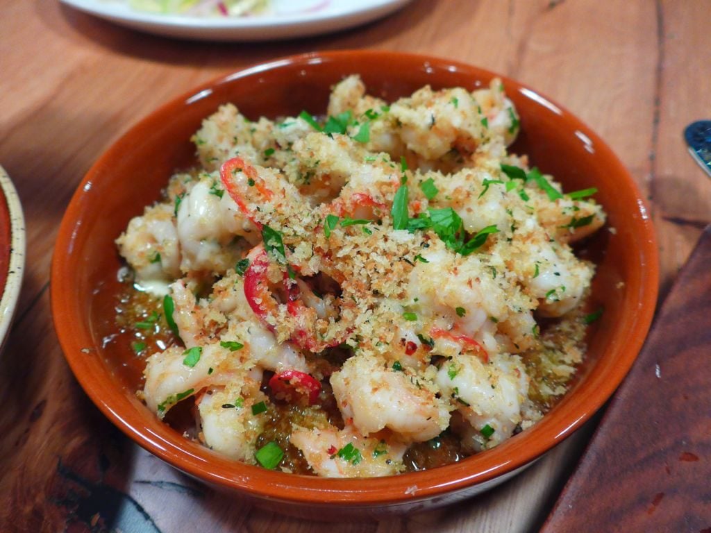 Antipasti include simple seafood and vegetable dishes like these shrimp with chilies and breadcrumbs. Photograph by Anna Spiegel