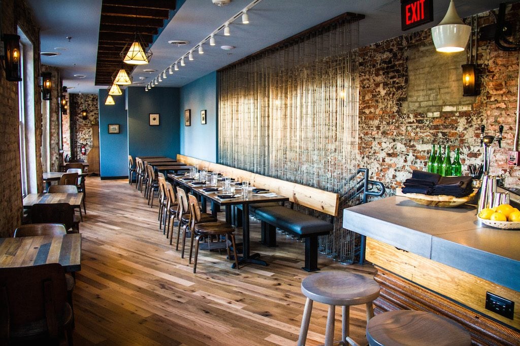 The second-floor dining room includes a 7-seat bar and tables for dining. Photograph by Farrah Skeiky