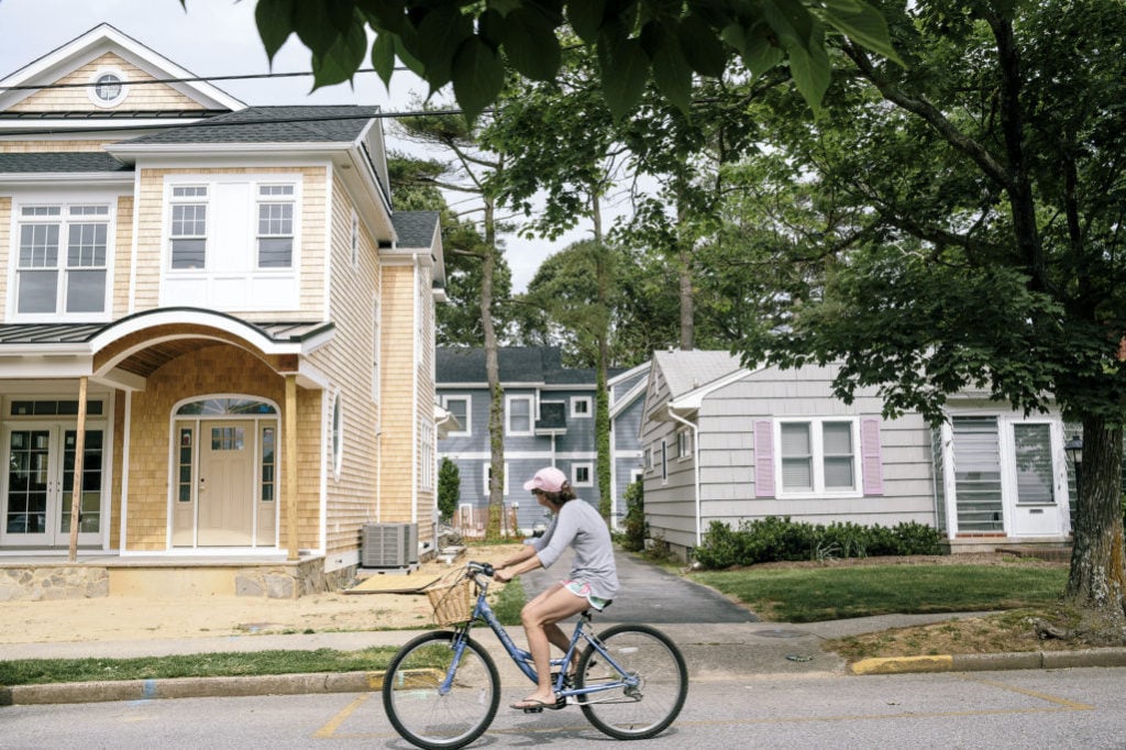 Across town, supersized new homes dwarf those built around the 1950s–a contrast made starker by the fact that most lots are small. Photograph by Lexey Swall.