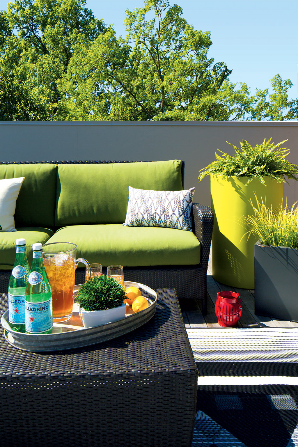 arlington-treehouse-roof-deck - Washingtonian Patio furniture from Crate & Barrel and CB2 keep the outside area of this Arlington roof deck modern and fresh. Photographs by Dan Chung. (July 2016/Chesapeake Bay)