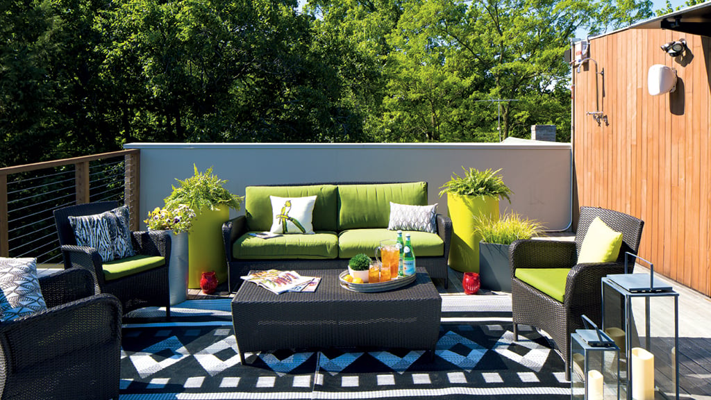 Patio furniture from Crate & Barrel and CB2 keep the outside area of this Arlington roof deck modern and fresh. Photographs by Dan Chung.