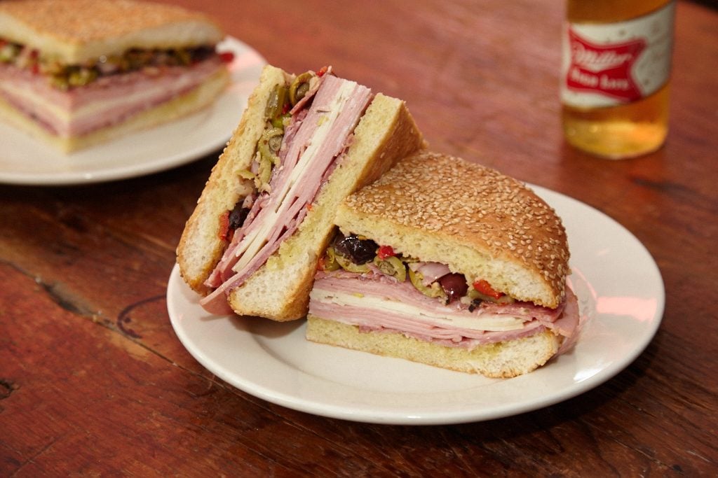 Chef Alex McCoy dishes up po' boys and muffaletta at Tchoup's Market. Photography by Jeff Elkins 