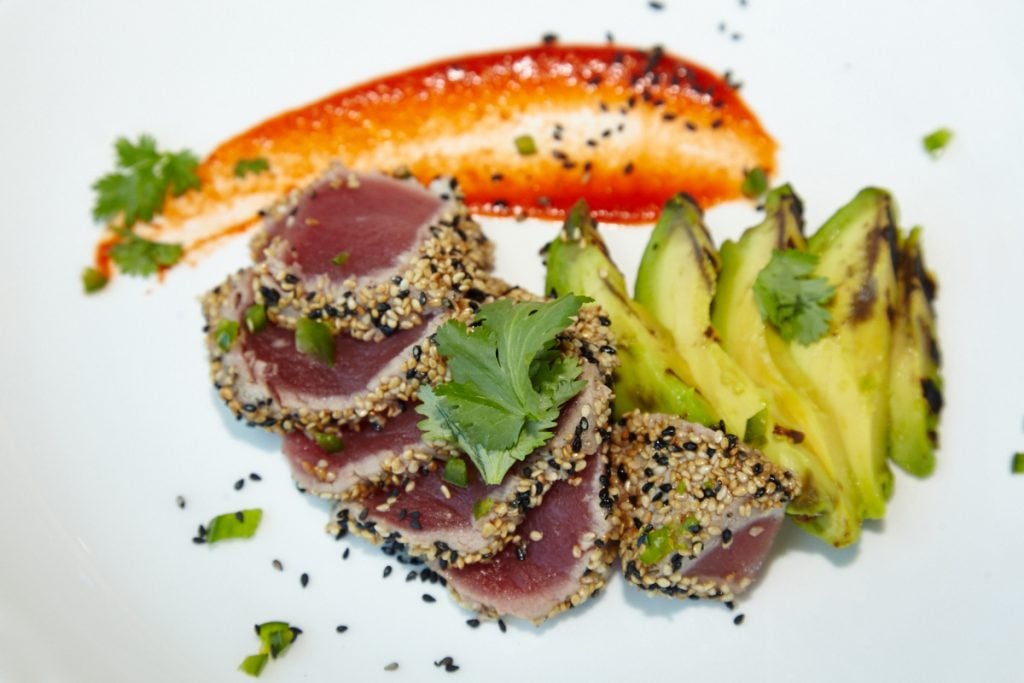 Chef Jonathan Kushner creates island-inspired dishes, such as sesame-crusted tuna with grilled avocado. 