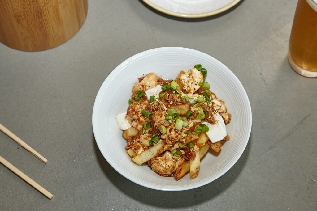 Spicy ma po tofu and poutine, together at last (there are crispy fries under all the goodness!). 