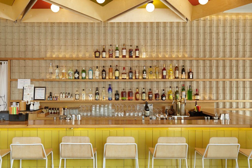 Drinkers can perch at the small drink bar, or another L-shaped counter in front of the kitchen. 