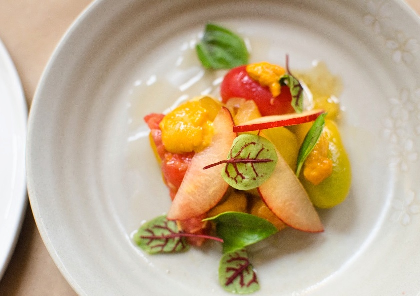 Chef Yuan Tang creates elegant dishes like uni with summer's bounty for Rooster & Owl. Photograph via Facebook