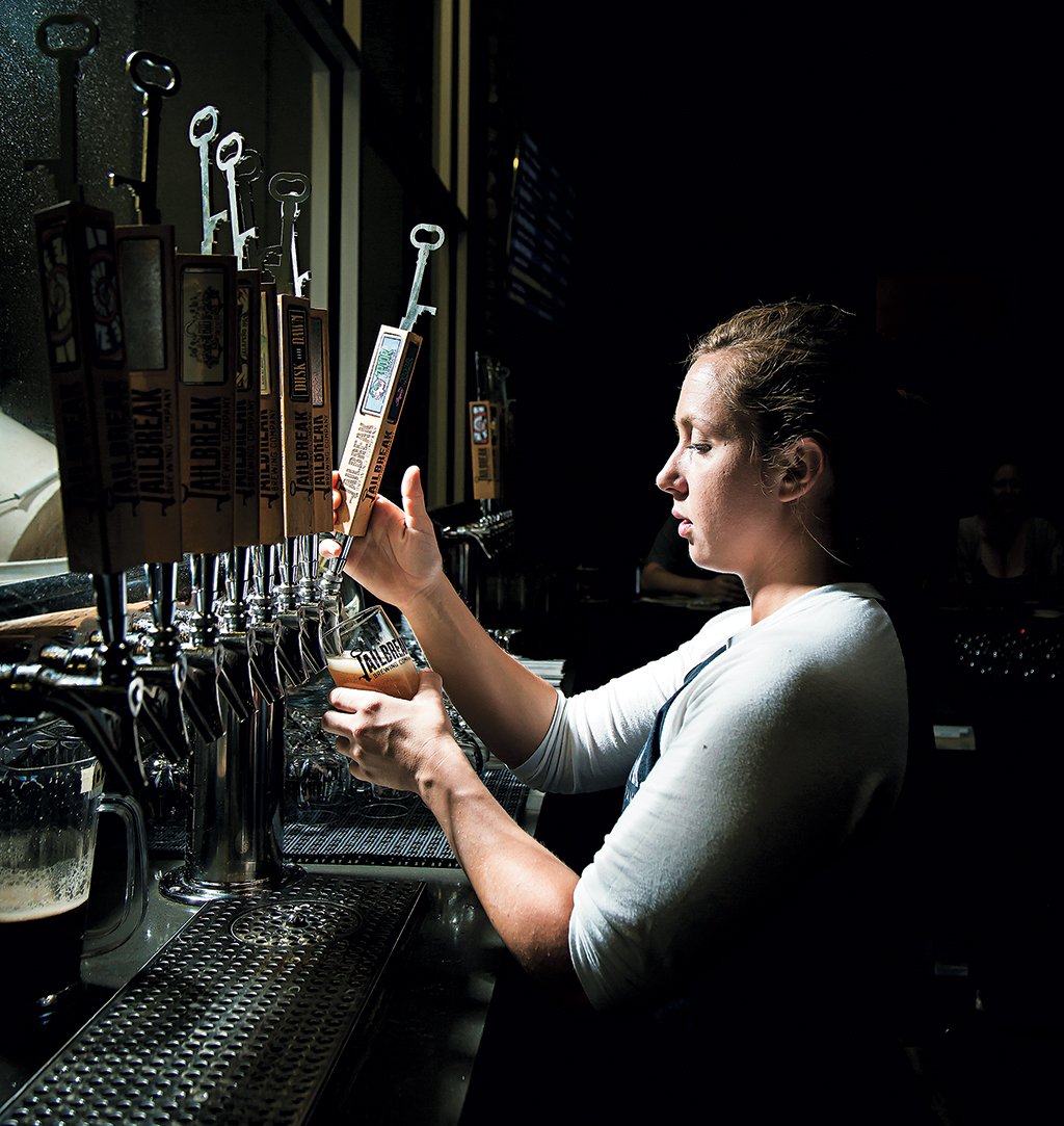 Bartender Liz Shear pulls an IPA at Jailbreak Brewing Company. Photograph by Scott Suchman.