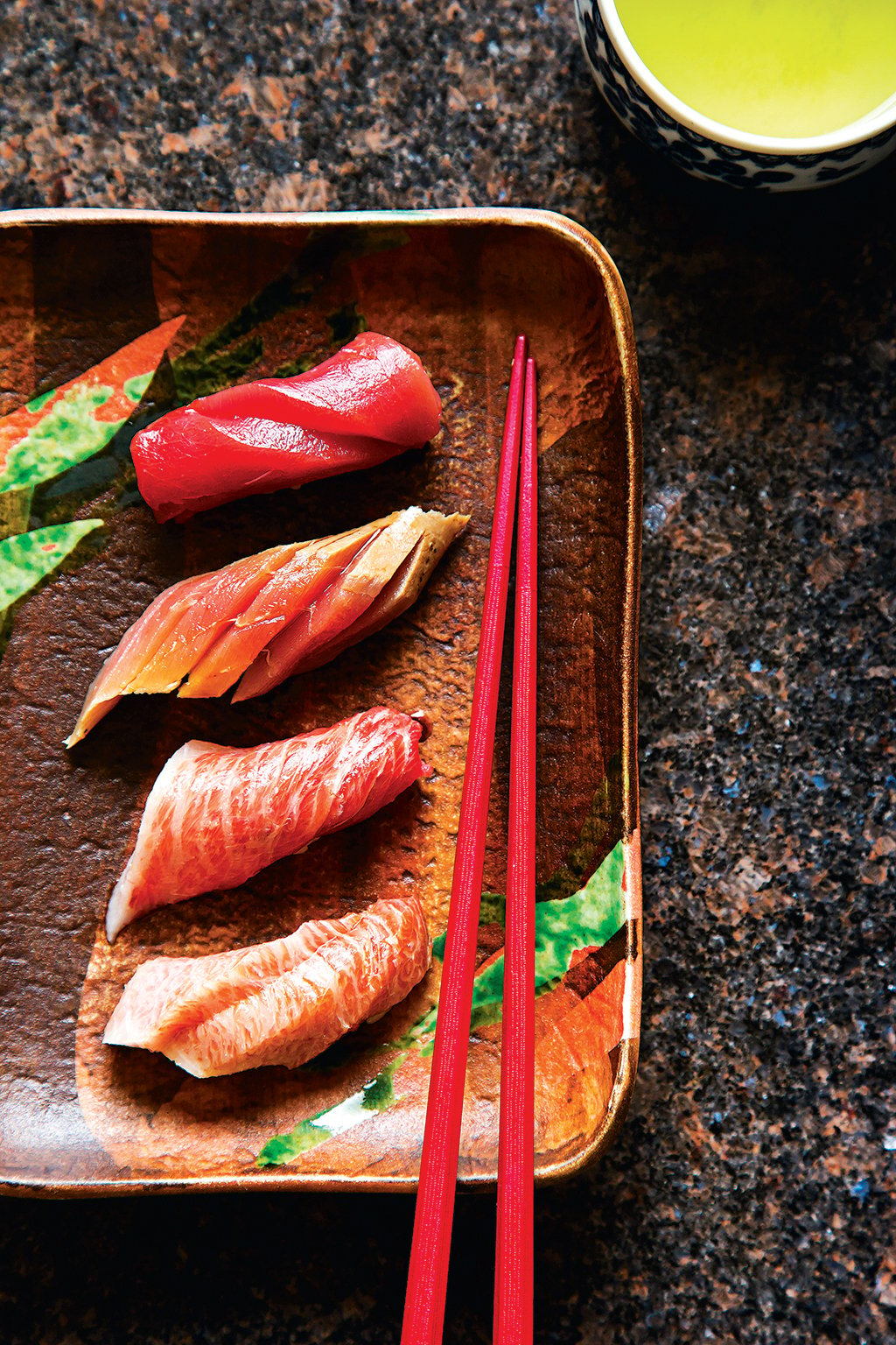 Sushi Ogawa: Four cuts of tuna with varying degrees of fattiness. Photograph by Scott Suchman.