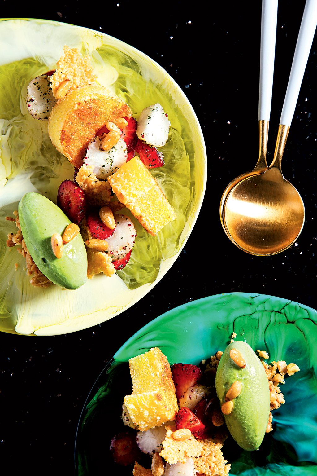 A dessert of pecorino cake with basil gelato and strawberries.