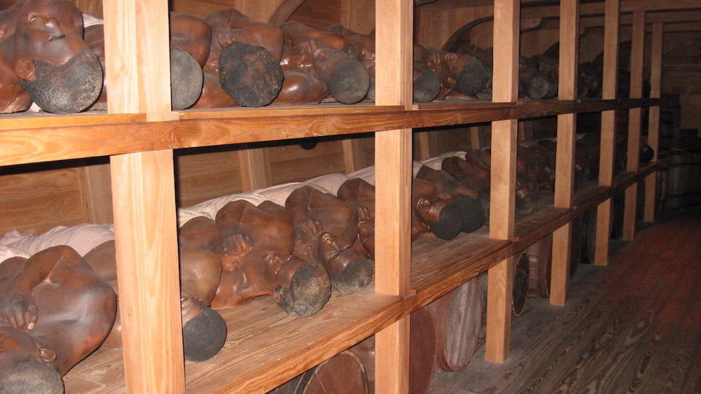 Wax figures represent slaves in the hull of the model slave ship in Detroit. Photograph courtesy of the Wright Museum.