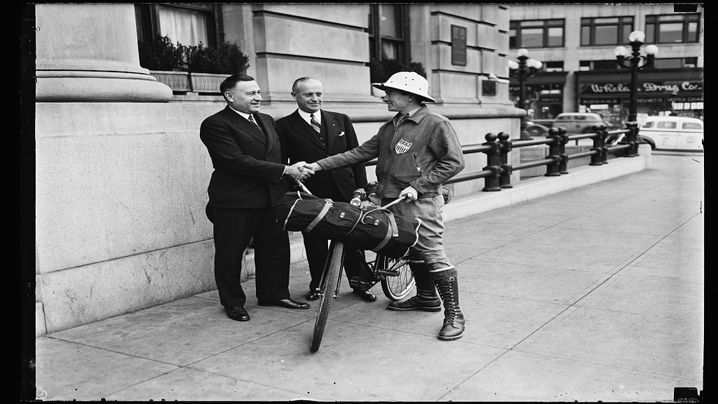 Washingtonian Henry G. Slaughter (right) meets with Charles M. Upham (left), Engineer and Director of the American Road Builders Ass'n. and H.F. Summerville (center), Managing Director of the Willard Hotel, before his international bike ride to promote the Inter- American highway in 1935. Photograph by Harris & Ewing 