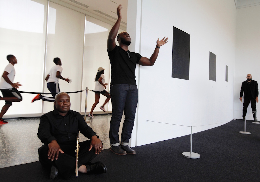 Howard students running behind the Black Monks of Mississippi during a rehearsal. Photo by Evy Mages.