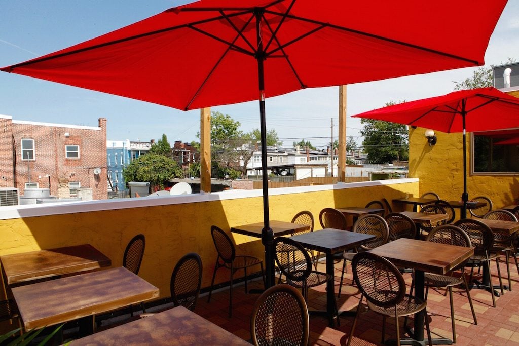 Patrons can order their pies on the rooftop, shaded with umbrellas. 