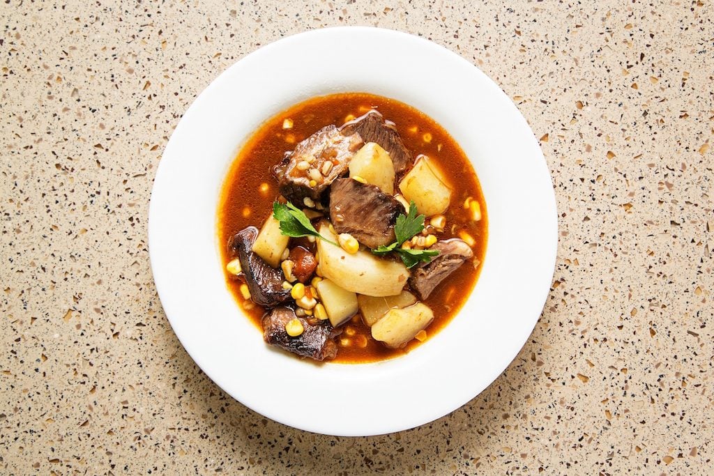 "Son of a gun" stew from the Western Range inspired by African American cowboys, filled with braised meat, potatoes, and vegetables. 