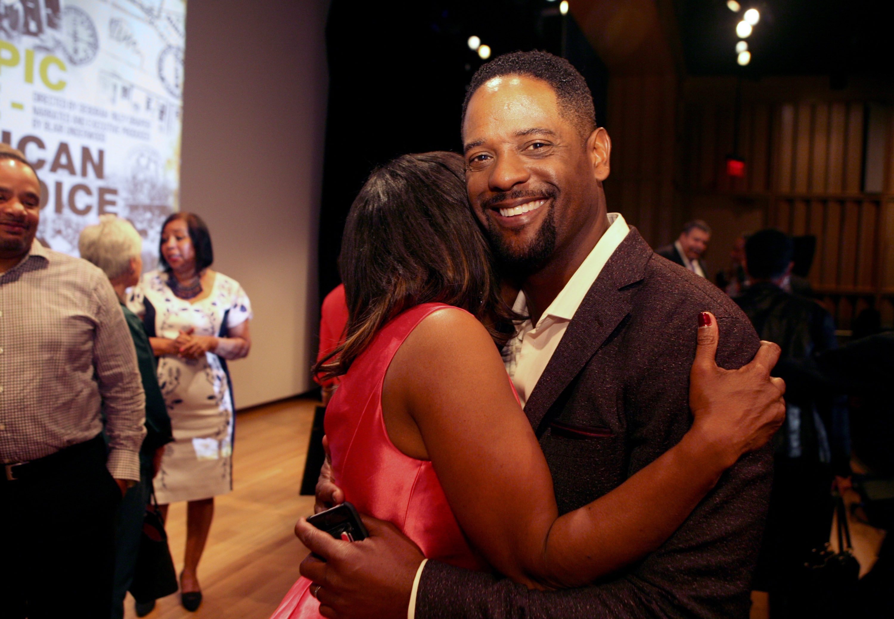 Blair Underwood, Narrator and Executive Producer hugs Director Deborah Riley Draper after the screening.