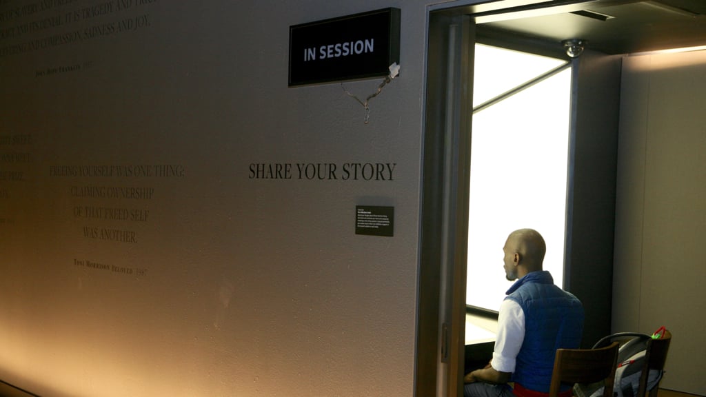 Black Lives Matter organizer DeRay McKesson shares his story in one of the Smithsonian's recording booths. Photograph by Evy Mages.