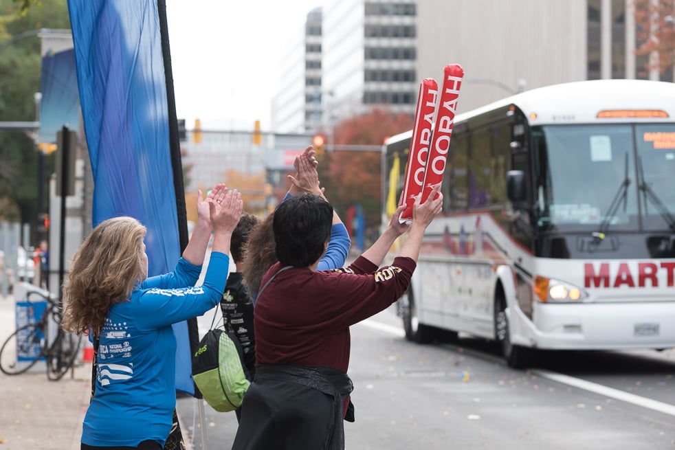 “It can get lonely when there’s no crowd around,” says Kath Sturgeon of Monmouth, Illinois (maroon shirt). Sturgeon is part of a foursome of marathon runners who met online years ago and became friends. On race day in 2015, the group waited in Crystal City to cheer on the last of the runners—including those on the bus. 