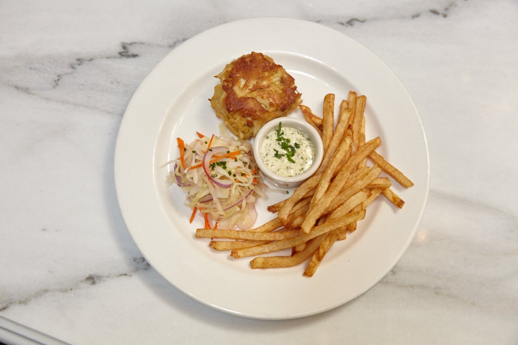 16099_johnnys_half_shell_0132 - Washingtonian Cashion's crab cakes, a staple of Johnny's since opening in 1999. In order to make the dish wallet-friendly, Cashion serves one instead of two at the new restaurant, plus sides.