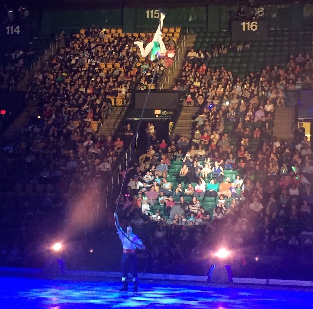 Disney on Ice: Ariel - Washingtonian Ariel is in the air while her prince is below her.