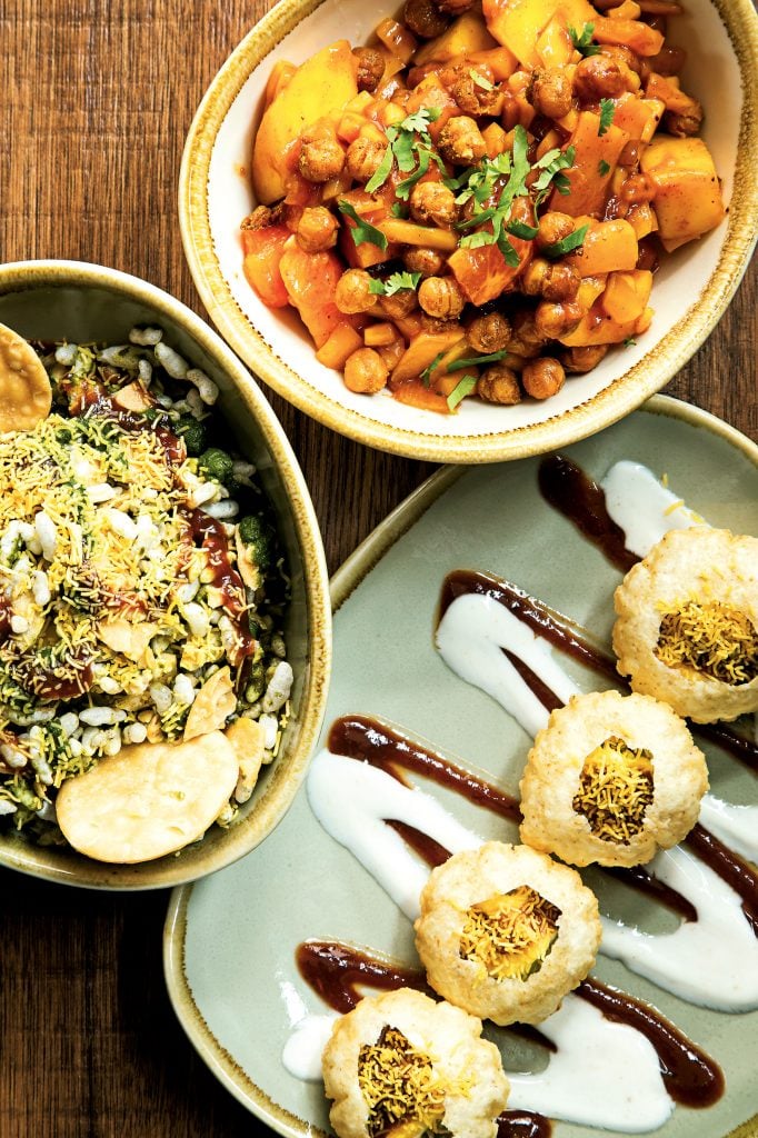 Clockwise from the top: a tropical-fruit salad, avocado golgappas, and bhel puri, a puffed-rice salad. Photo by Scott Suchman.