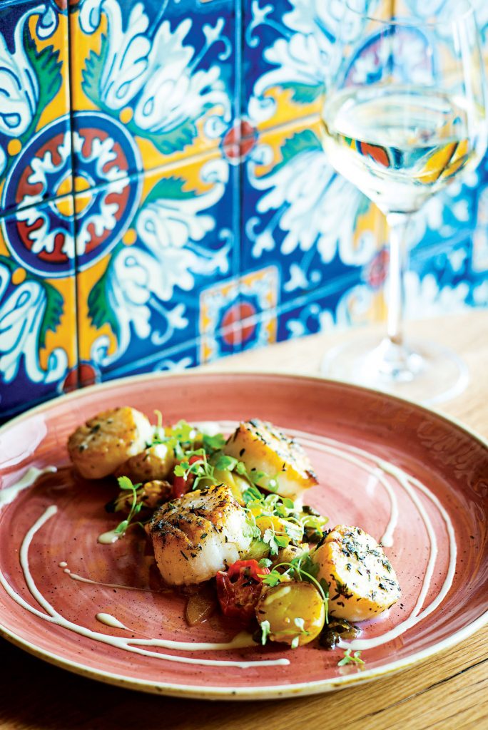 Scallops with lemon, capers, and zucchini. Photo by Scott Suchman.