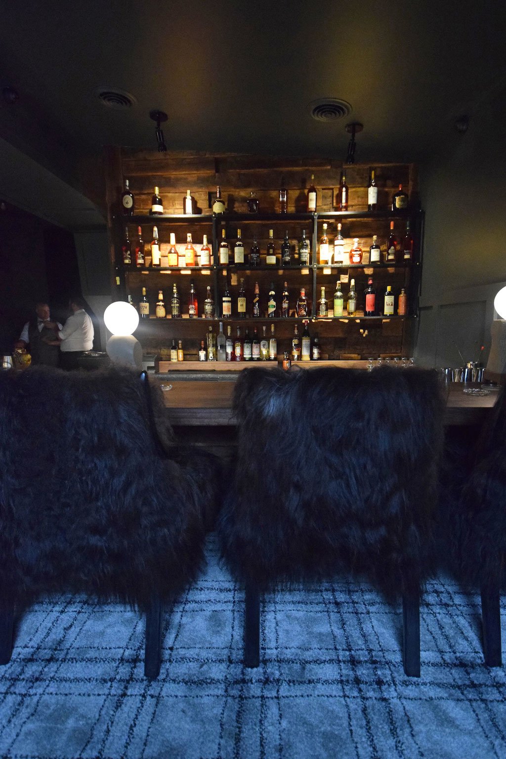 Icelandic sheepskin chairs are the comfiest bar seats in town. 