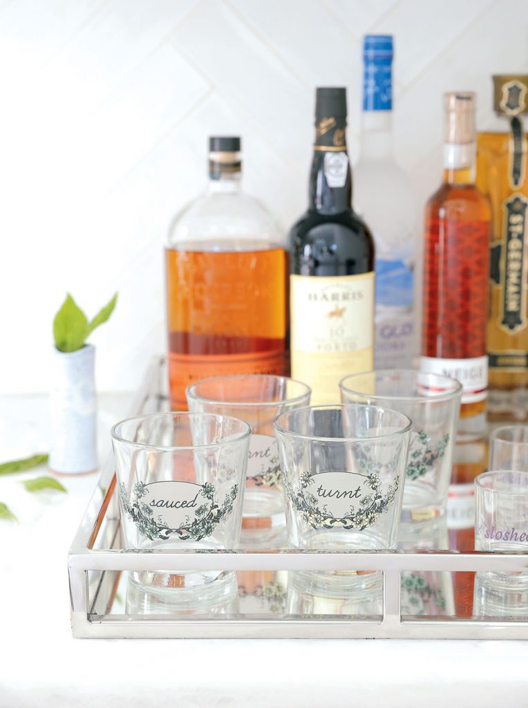 The cheeky lowball glasses are from Salt & Sundry. Photo by Christopher Shane.