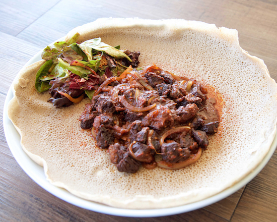 Eyo's Awaze Tibs made from cubed lamb or beef marinated and cooked with tomatoes, jalapeño, garlic and berbere sauce.