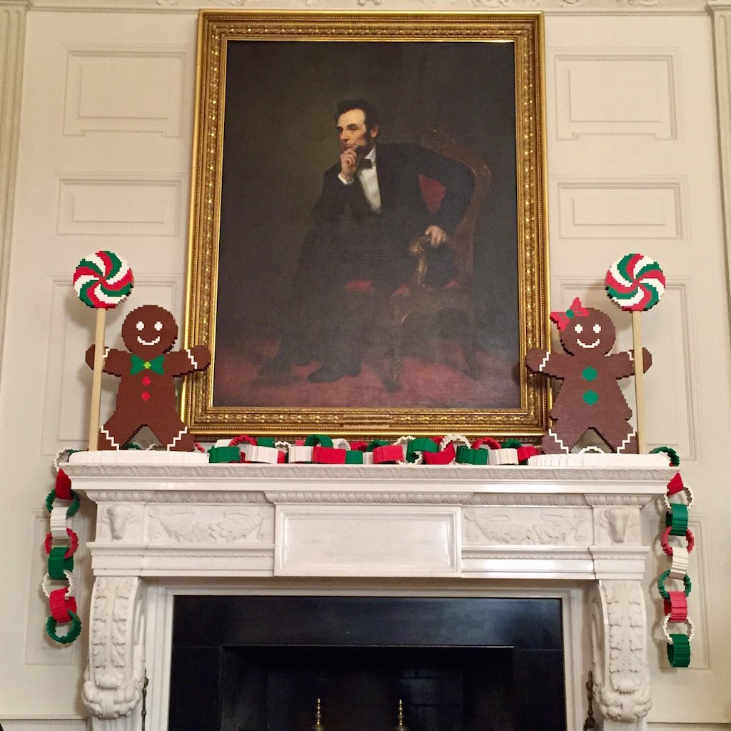 Painting of Abraham Lincoln framed by lego gingerbread men. Photo by Andrea Marks.
