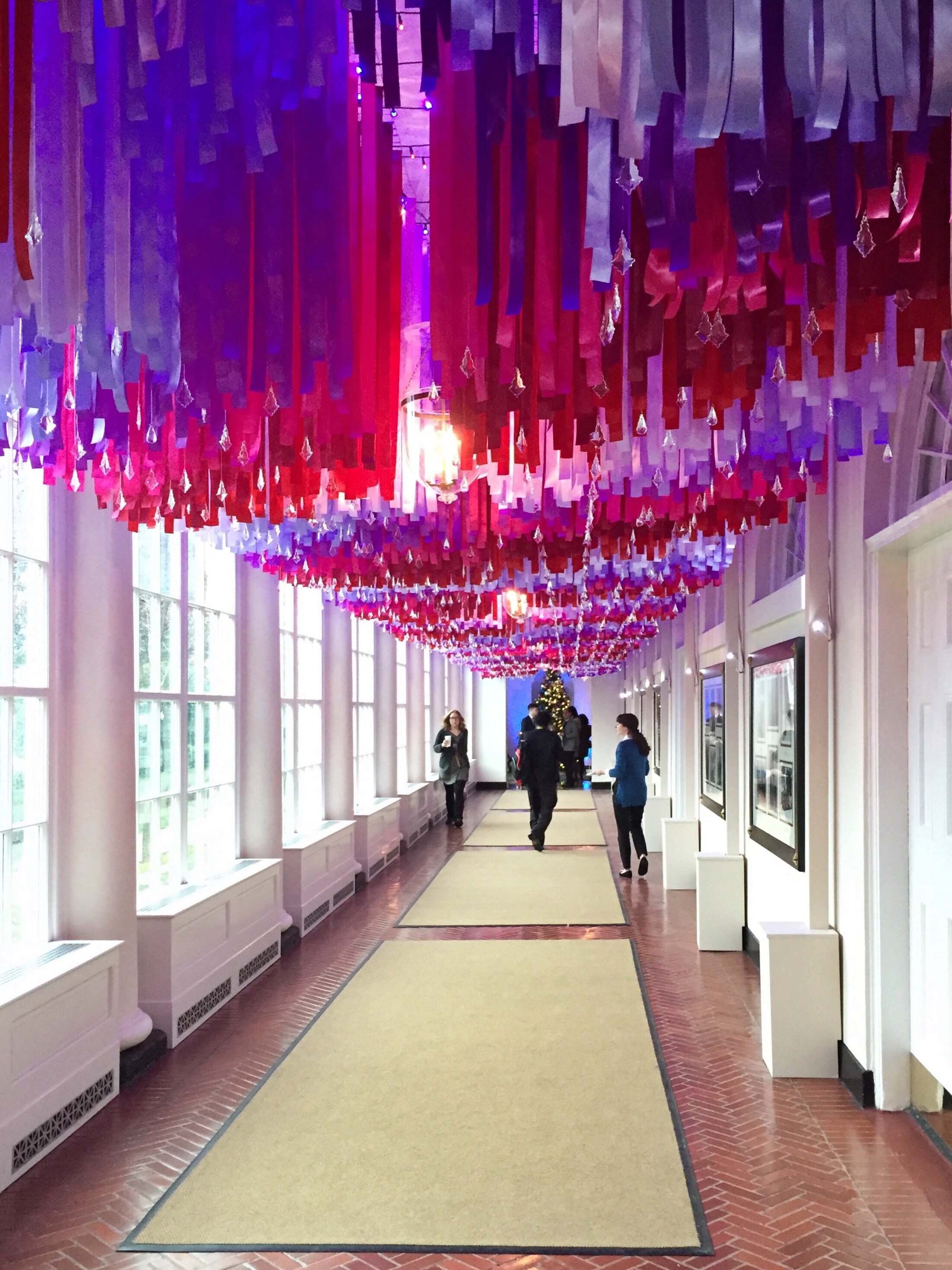 More than 7.500 red,white, and blue ribbons hanging in the East Colonnade of the White House. Photo by Andrea Marks.