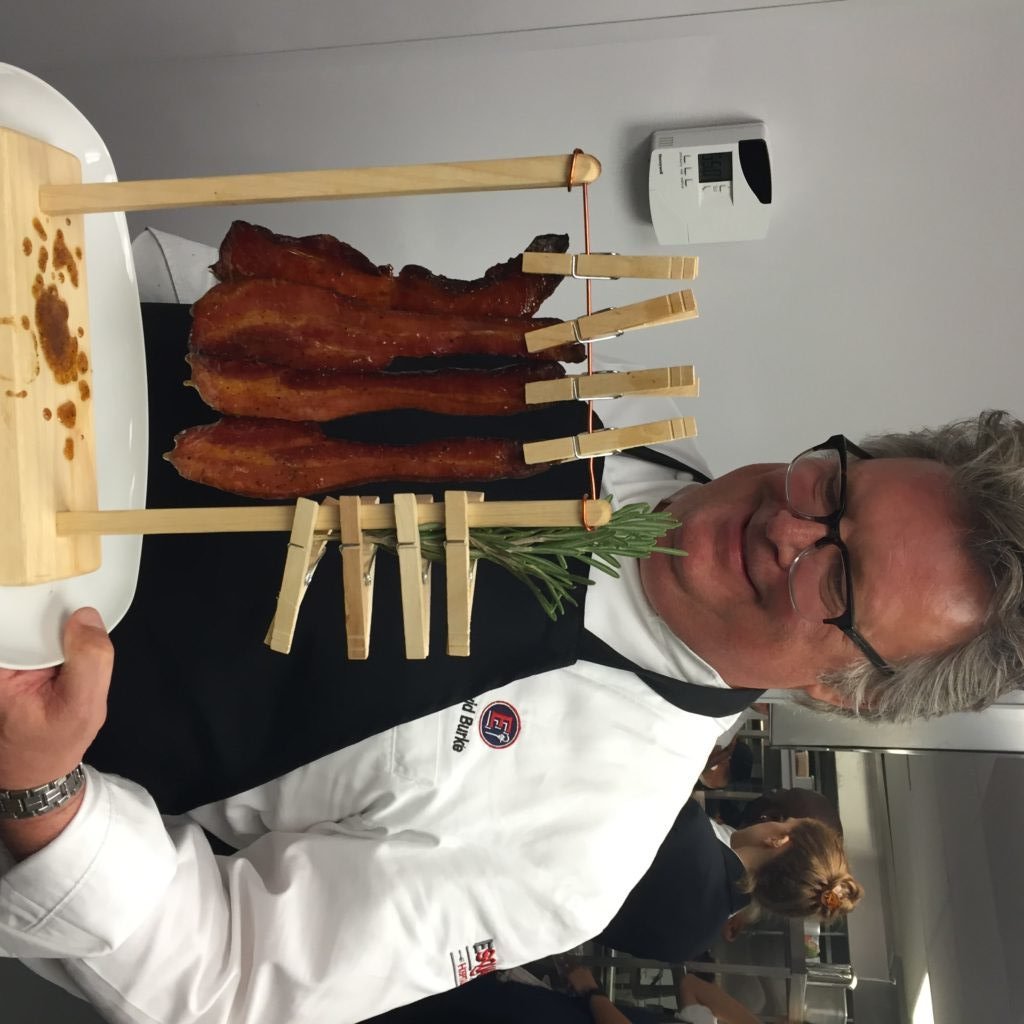 David Burke serving hanging bacon at the Trump Hotel. Photo by Jessica Sidman.
