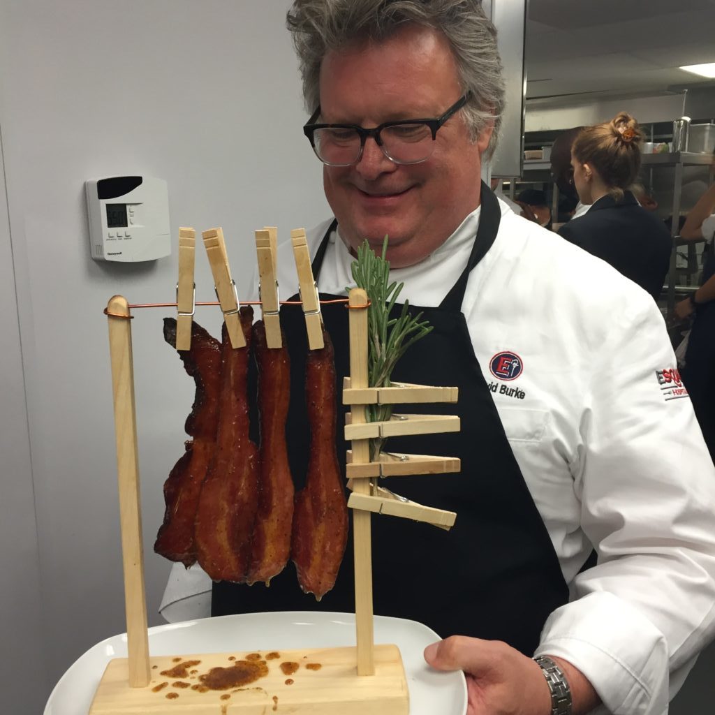 David Burke serving hanging bacon at the Trump Hotel. Photo by Jessica Sidman.