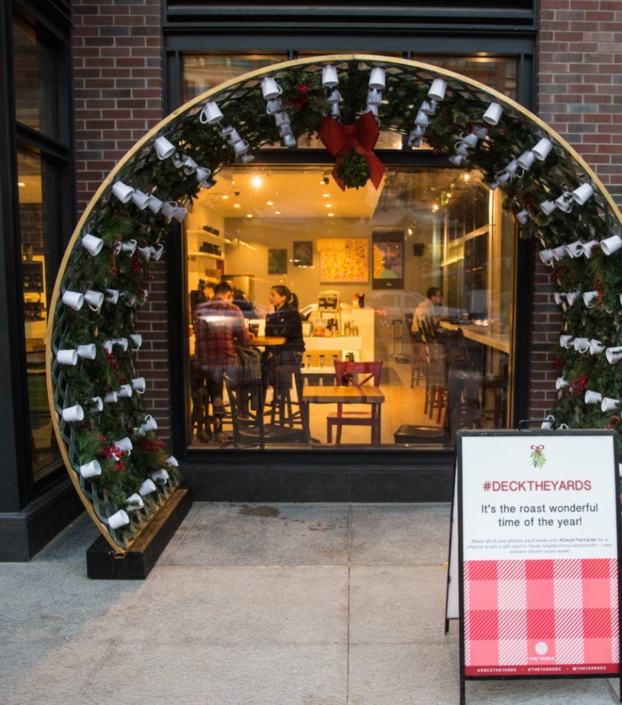 Java Archway featuring mistletoe and coffee cups.