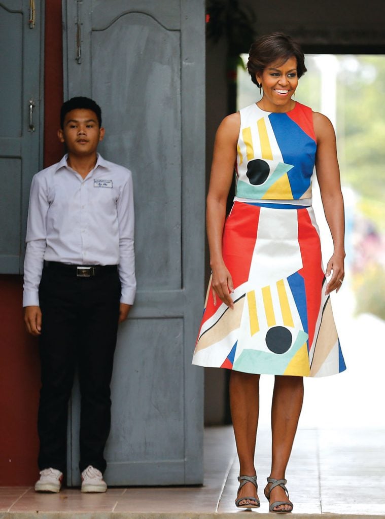 Michelle Obama wore this sleeveless sheath during a visit to a school in Siem Reap province, Cambodia on March 21, 2015. Photo by AP Images.