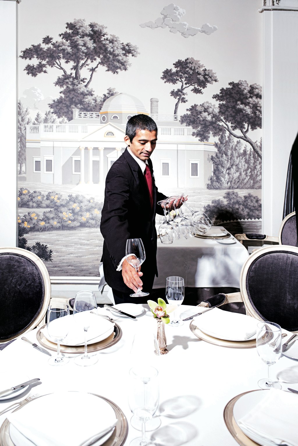 Christian Gaston, Captain at Plume, sets a table.