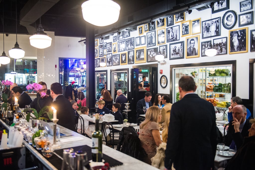 The restaurant, named after the owner's late father, is hung with family pictures and antique mirrors. 