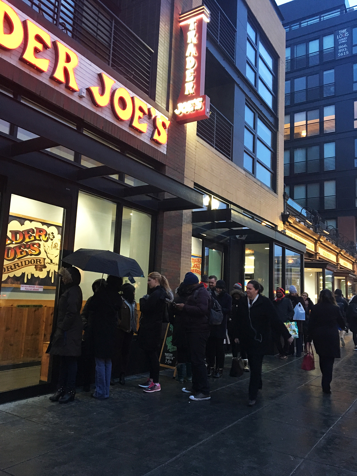 Washingtonians lining up outside of the Shaw Trader Joe's to stock up on snow day supplies. Photograph by Julie Strupp.