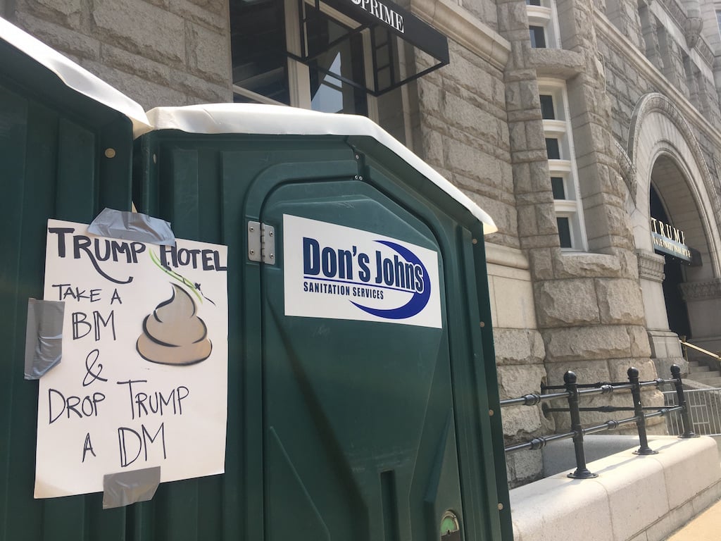 People Are Having a Lot of Fun Putting Signs on These Porta-Potties by the Trump Hotel