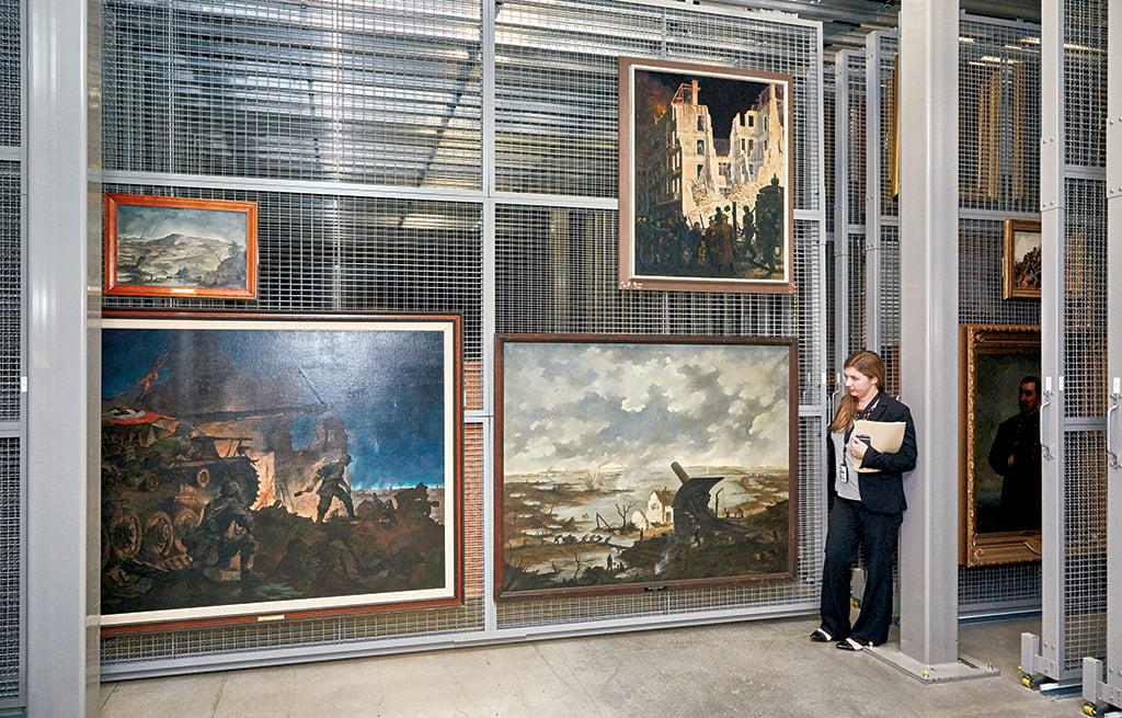 US Army Center of Military History curator Sarah Fogey with Nazi art. Photograph by Jeff Elkins.
