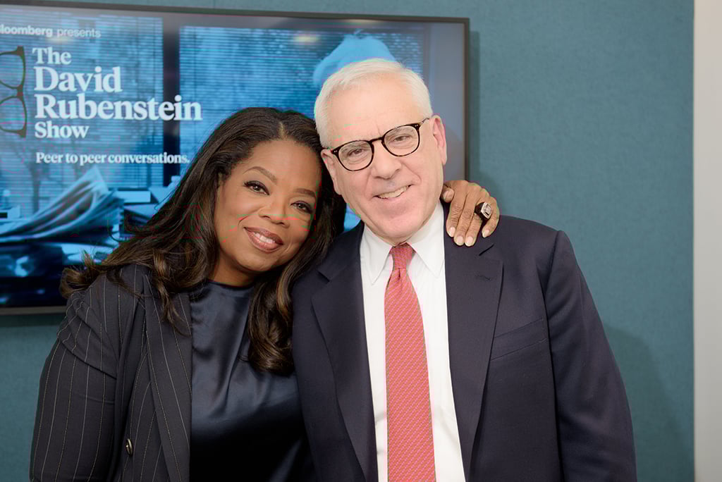 Rubenstein with Oprah. Photograph courtesy of Jean-Pierre Uys Photography/Bloomberg. Rubenstein with Oprah. Photograph courtesy of Jean-Pierre Uys Photography/Bloomberg.