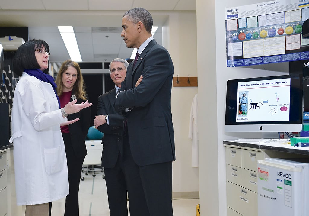 Sounds of science: Ebola researcher Nancy Sullivan, Burwell, National Institute of Allergy and Infectious Diseases director Anthony Fauci, and President Obama. Photograph by Mandel Ngan/AFP/Getty Images.