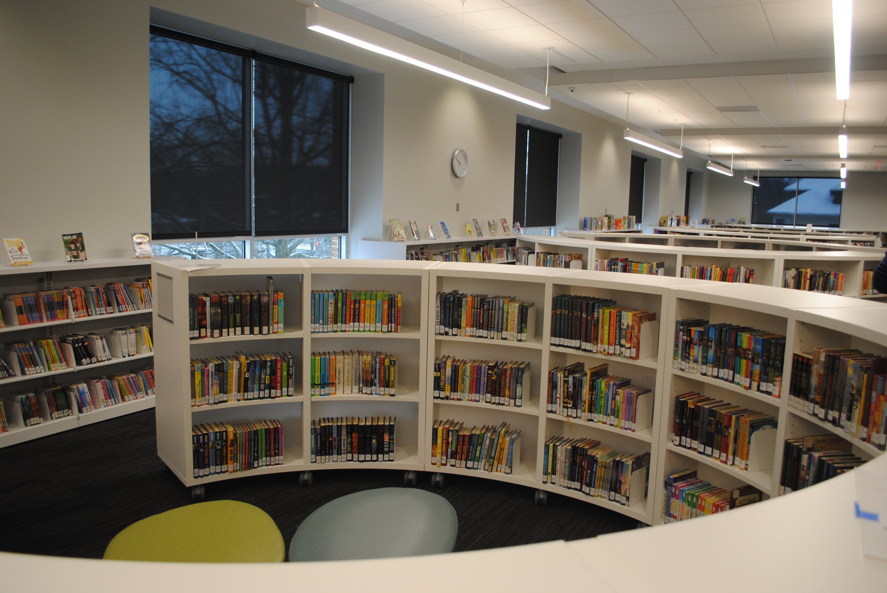 The children’s section features several circular bookshelf 