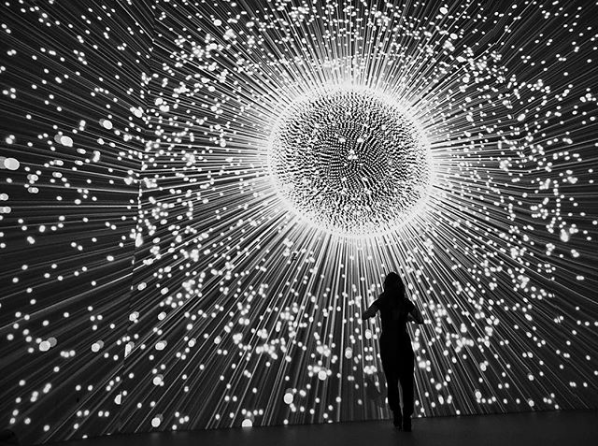 One gallery visitor poses in front of the lit-up exhibit. Photo from Instagram user @golightly