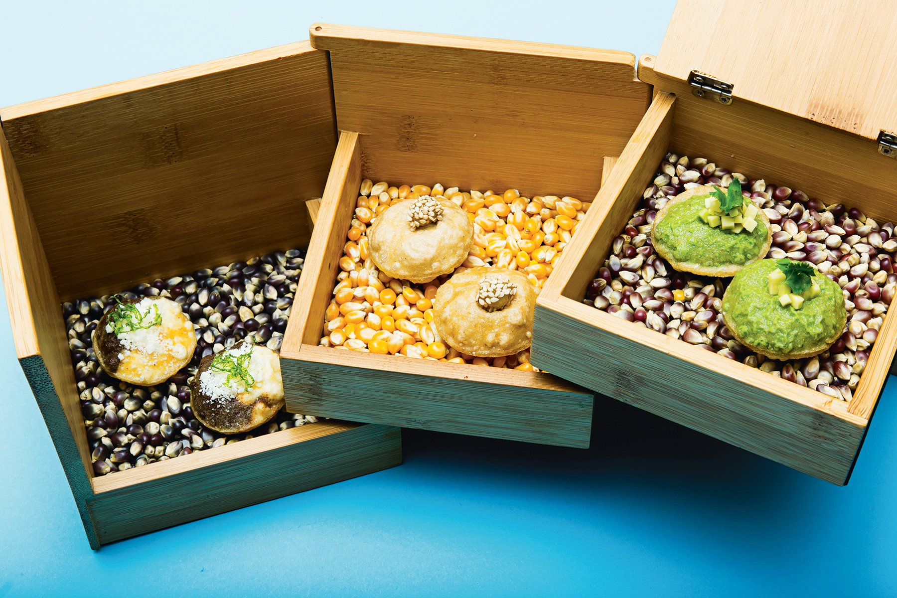 Wooden jewelry box for masa puffs at Pineapple and Pearls. Photograph by Scott Suchman.