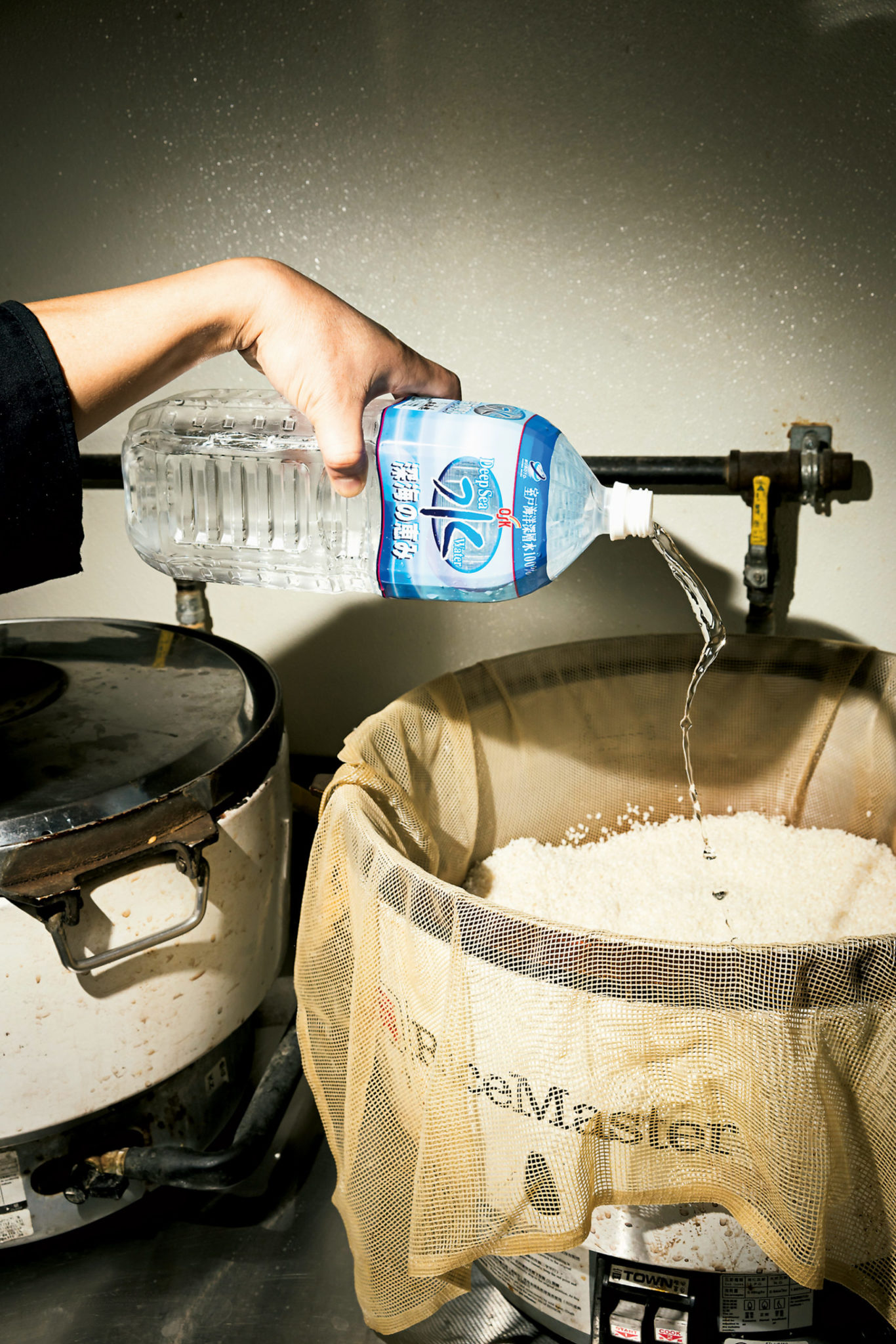 Kobo imports 1,200 bottles of deep-sea water from Japan every three months. The chefs say the neutral, softer water makes the rice—like New York bagels—better. Photograph by Scott Suchman.